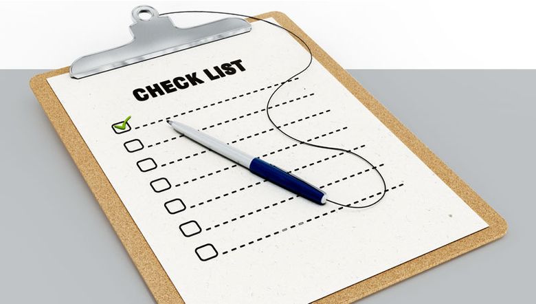 Board and pen with a checklist on it